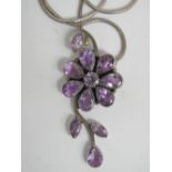A large silver and amethyst pendant,