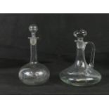 A plain glass flat bottom ships decanter