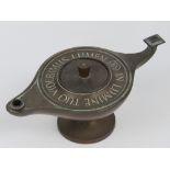 An Aladdin style oil lamp bearing legend