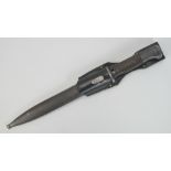 A WWII German Mauser K98 rifle bayonet in scabbard with leather hanger, dated 1943.