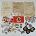 A quantity of German militaria including; awards, medals and paperwork.
