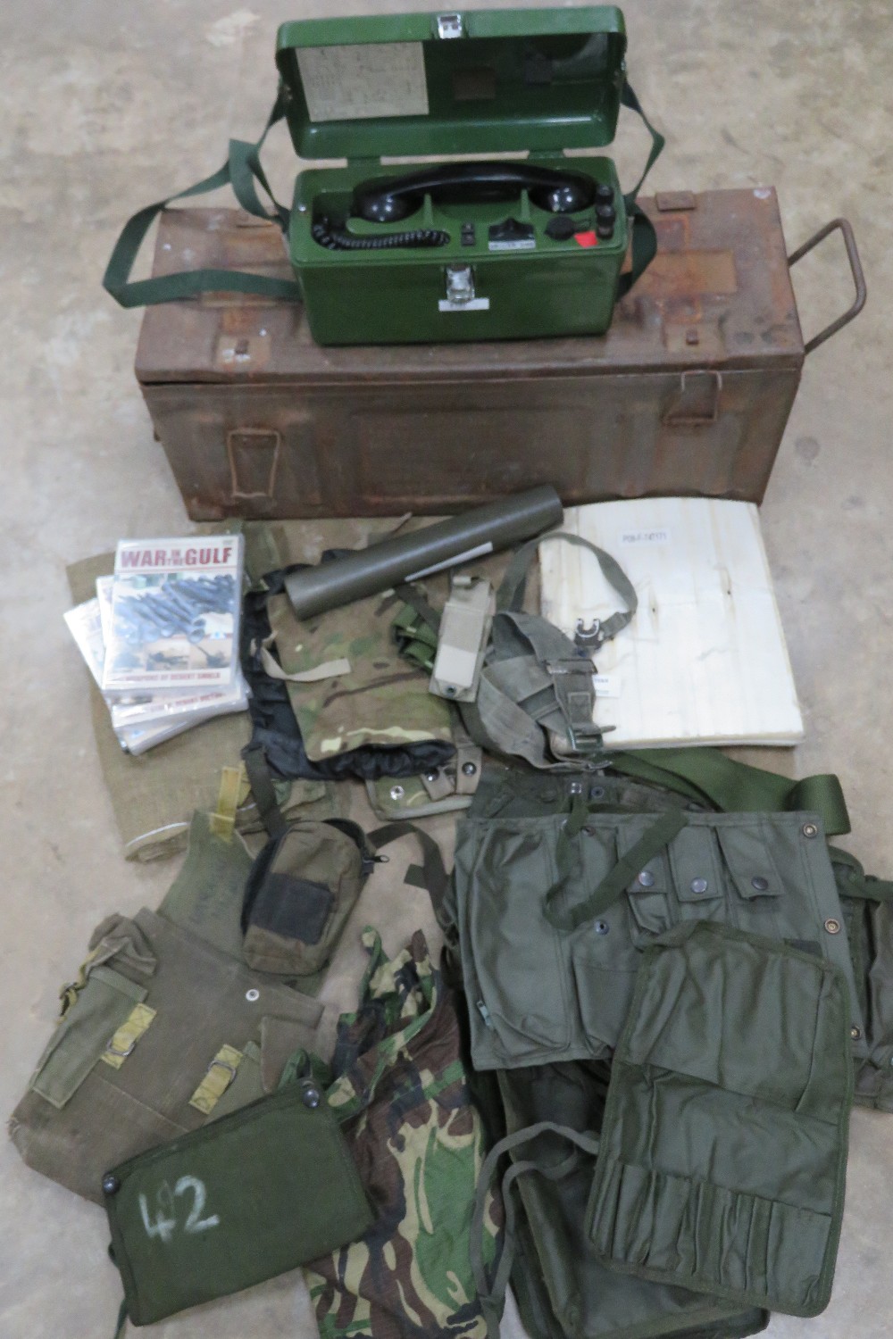 A quantity of modern militaria including; pouches, telephone, webbing, etc.