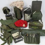 A quantity of assorted militaria including rare East German gas mask,