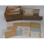 A large collection of loose and stuck down world stamps sorted into envelopes by country,