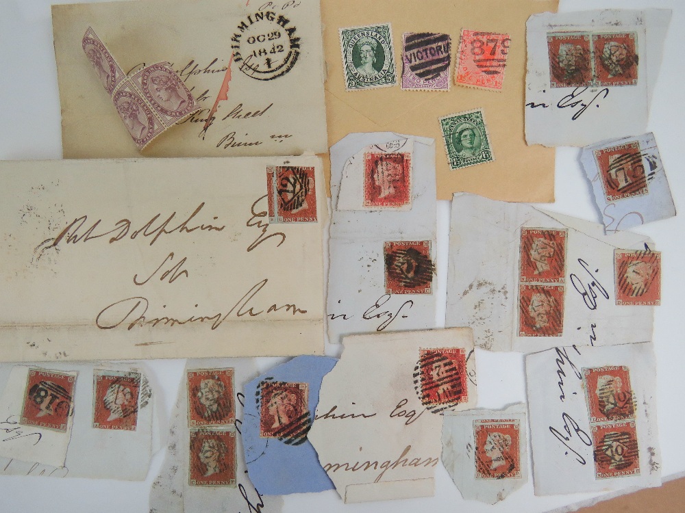 A large collection of loose and stuck down stamps, mostly used,