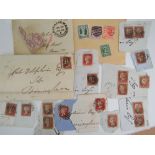 A large collection of loose and stuck down stamps, mostly used,