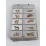 A collection of John Player & Sons cigarette cards sorted into sets/part sets in binder pages,