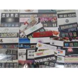 A quantity of Royal Mail mint presentation pack stamps including; 'Famous Trains', 'Heraldry',