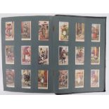 Three vintage 'Cigarette Pictures' albums containing a quantity of cigarette cards by Wills and