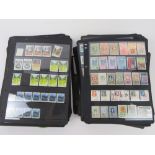 A large quantity of stamps in loose leaf binder pages, approximately 150 pages unbound.