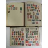 Three vintage stamp albums having assorted, stuck down, world stamps within.