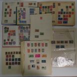 A quantity of assorted World stamps on stuck down sheets,