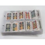 A collection of John Player & Sons cigarette cards sorted into sets/part sets in binder pages,