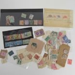 A quantity of used stamps in loose and stuck down condition,