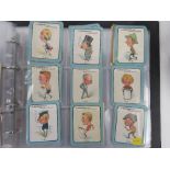 A quantity of cigarette cards within two binders in sets/part sets,