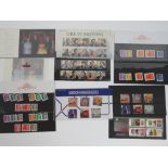 Five Royal Mail mint presentation pack stamps with matching stamp sets;