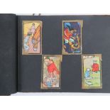 An album containing a quantity of Chinese cigarette cards,