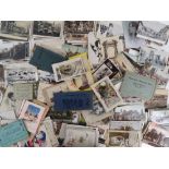 A quantity of loose 20th century vintage postcards including military, topographical,