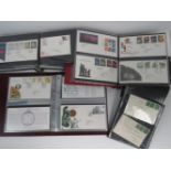 A collection of first day covers in four albums including; 'Christmas 1986', 'Sir Isacc Newton',