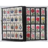A quantity of cigarette cards within two albums;