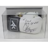 A signed Amir Khan boxing glove within presentation case.