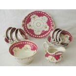 A quantity of 19th century English Rockingham style tea ware with pink and gilt decoration.