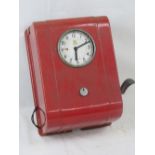 A vintage TR Services wall mounted clocking-in machine bearing circular clock dial with Arabic