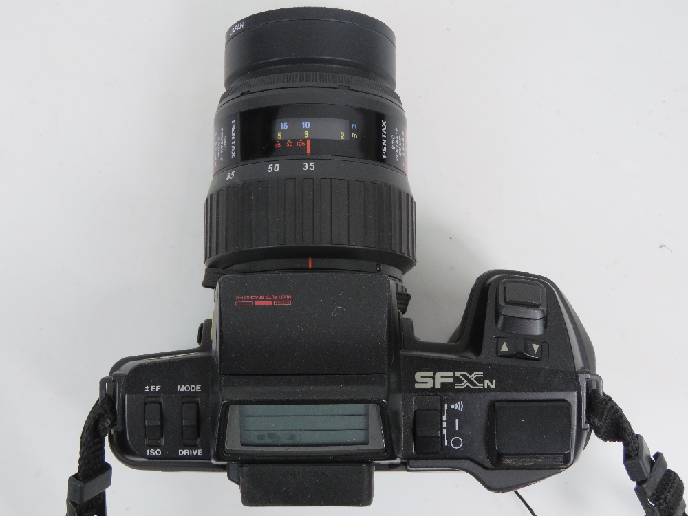 A Pentax SFX 35mm SLR camera with 35-135mm 1:3.5-4.5 lense, with padded carry case and strap. - Image 2 of 3