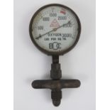 A brass oxygen safety gauge registering to 3000 LBS per Sq. In., 10cm dia.