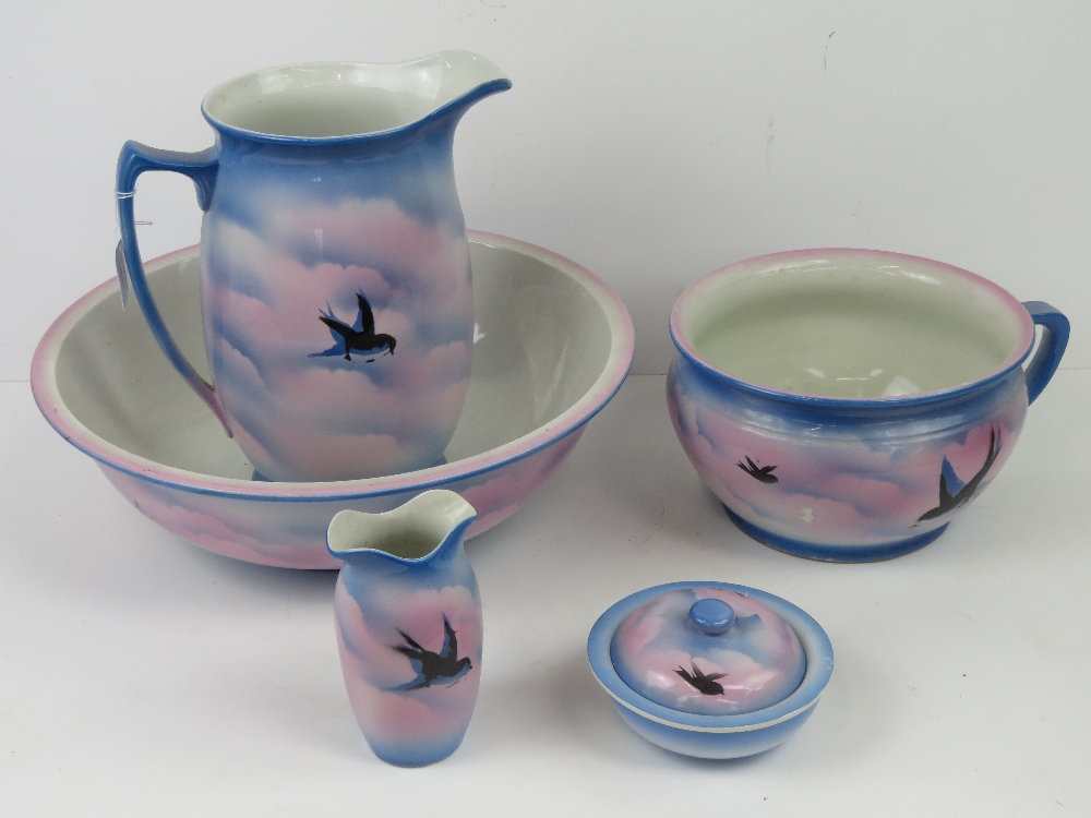 A c1930s wash jug and bowl set complete with chamber pot and toothbrush holder,