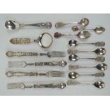 A set of six 800 grade silver teaspoons having floral terminals, an 800 silver 'Napoli' spoon,