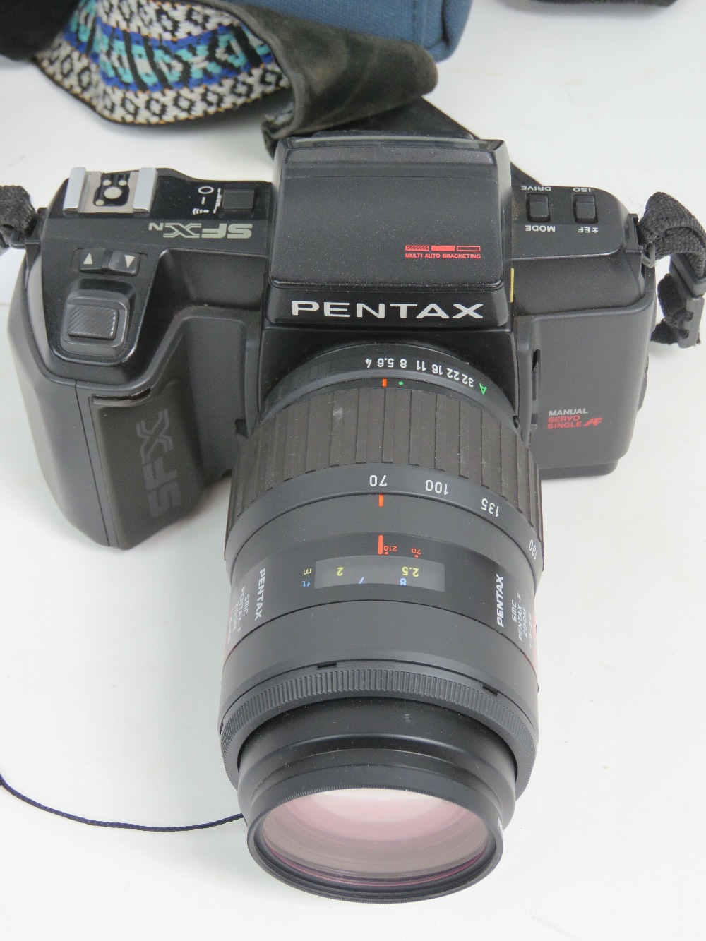 A Pentax SFX 35mm SLR camera having 70-210mm 1:4-5.6 Pentax lense, with padded carry case. - Image 3 of 3