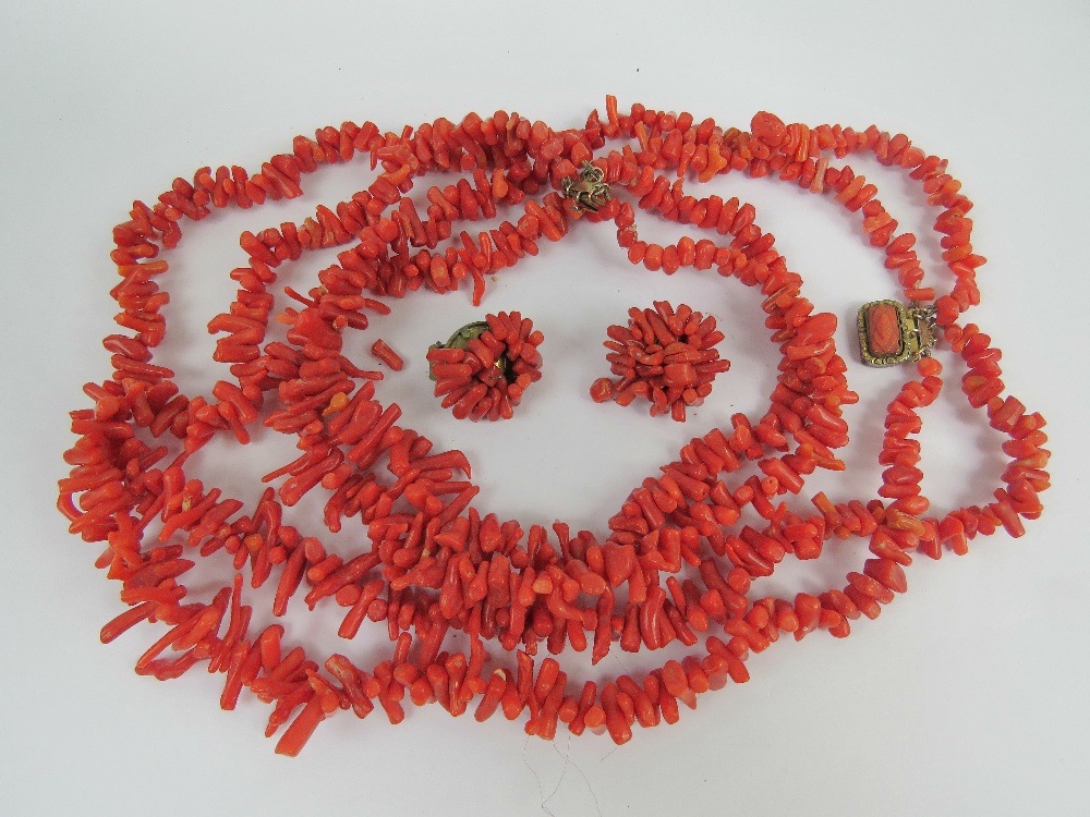 A Victorian coral branch short necklace having three graduated strands and gilt metal clasp,