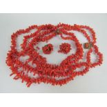 A Victorian coral branch short necklace having three graduated strands and gilt metal clasp,