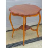 An Edwardian mahogany planter table raised over shaped legs.