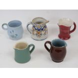 Five assorted jugs including Doulton, Denby, etc.