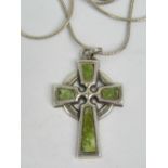 An agate and white metal pendant in the form of a Celtic cross, marked made in England, 3.