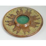 An olivewood and pierced brass decorative shaped stand with green baise interior, 22cm dia.