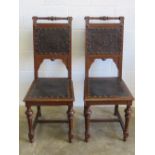 A good pair of Victorian high back oak framed chairs having embossed leather and studded decoration