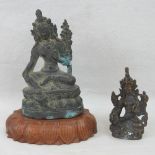 Two small bronzed brass Indian deity figurines, each in seated position,