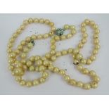 A sting of faux pearls a/f.