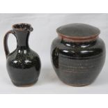 A Raymond Finch studio stoneware pottery jar and cover, 12cm high and a studio pottery jug,