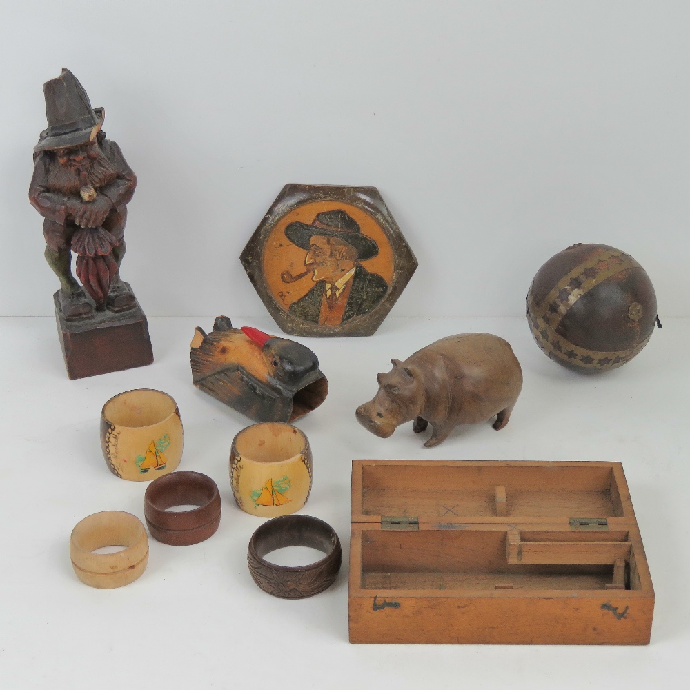 A quantity of assorted carved wooden items including hippo, 13cm in length, five napkin rings,