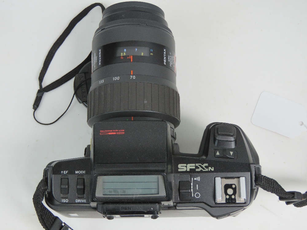 A Pentax SFX 35mm SLR camera having 70-210mm 1:4-5.6 Pentax lense, with padded carry case. - Image 2 of 3