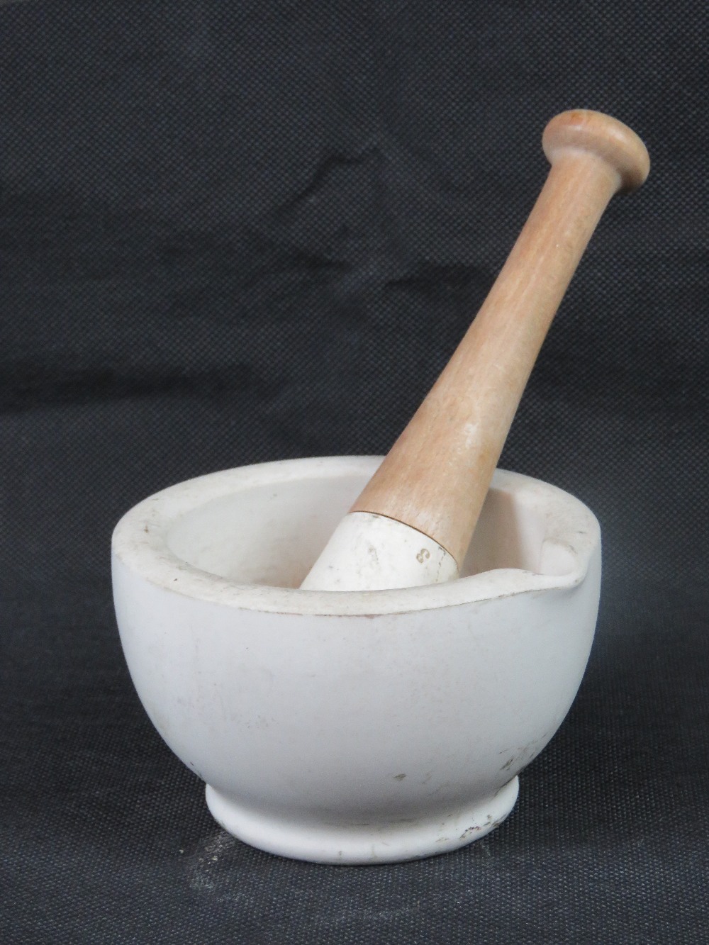 An alabaster mortar and pestle, 13cm dia.