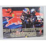 A 2010 Red Bull racing 'World Constructors Championship' poster in clip frame,