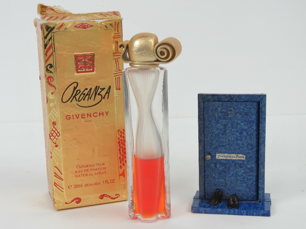 A vintage Givenchy Organza perfume bottle with partial contents and box,