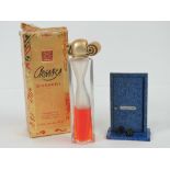 A vintage Givenchy Organza perfume bottle with partial contents and box,