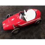 A Tri-ang Ferrari pedal race car C1960s. Finely detailed metal body measuring 120cm in length.