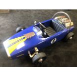 A Lola pedal race car C1960s. Finely detailed metal body measuring 116cm in length.